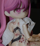 Tattooed articulated doll